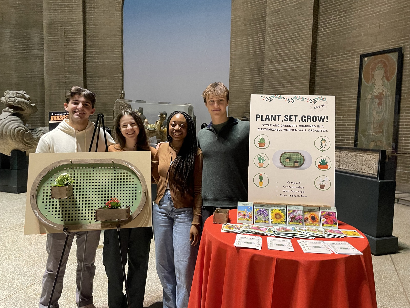 Marco and his team at the design fair with the Plant, Set, Grow organizer and poster